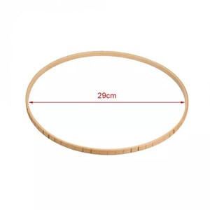 May include: A wooden embroidery hoop with a diameter of 29 inches.