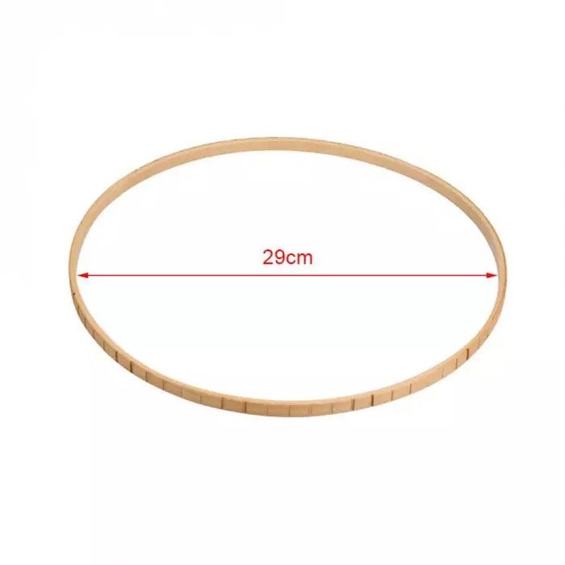 May include: A wooden embroidery hoop with a diameter of 29 inches.