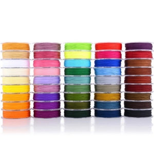 May include: A collection of 24 spools of colourful waxed cord, each wound neatly and stacked in rows. The cords are in a variety of bright and muted colours, including red, blue, green, yellow, orange, purple, pink, and brown.