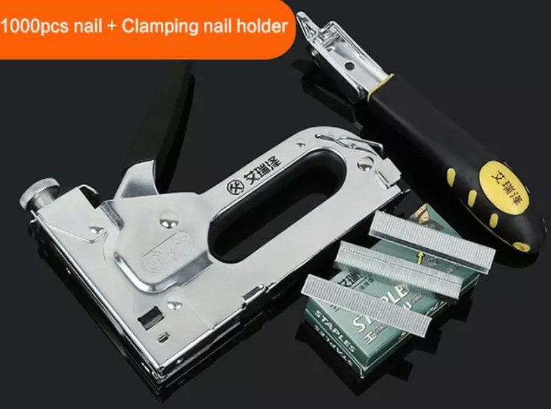 May include: A silver staple gun with a black handle and a clamping nail holder. The image also shows a box of staples and a stack of staples. The text "1000pcs nail + Clamping nail holder" is in the top left corner.