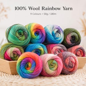 May include: A collection of 100% wool rainbow yarn balls in a wooden container. The text reads 100% Wool Rainbow Yarn, 9 Colours, 50g / 180m. Each ball features a vibrant gradient of colours including green, blue, pink, orange, and purple tones.