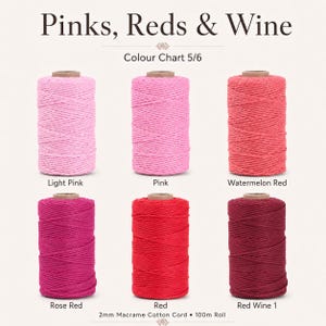 May include: Six spools of 2mm macrame cotton cord arranged in two rows. The colors are labeled as Light Pink, Pink, Watermelon Red, Rose Red, Red, and Red Wine 1. The text Pinks, Reds & Wine, Colour Chart 5/6, and 2mm Macrame Cotton Cord 100m Roll appear.