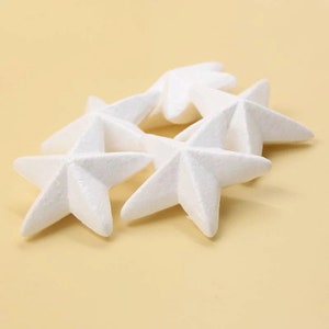 May include: Five white foam star shapes, perfect for crafting or decorating.