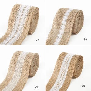 May include: Four rolls of tan burlap ribbon, each featuring a unique white lace trim down the center. The rolls are labeled with the numbers 27, 28, 29, and 30, showcasing different intricate lace patterns on the textured, woven fabric material.