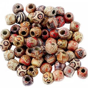 May include: A collection of wooden beads with various colourful patterns. The beads are round and have a hole in the centre. They are perfect for making jewellery or other crafts.