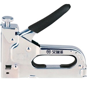 May include: A silver-colored staple gun with a black handle and a silver adjustment knob. The tool has a curved handle and a rectangular body. The text "艾瑞泽" is printed on the side of the tool.