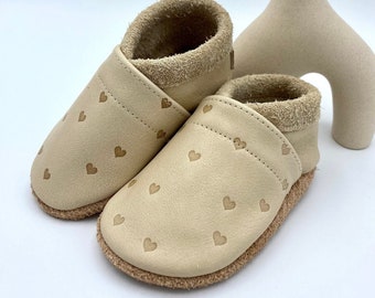 Slippers for children in walnut color with embossed hearts and lettering, crawling shoes with embossing