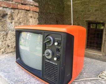 Orange space age TV, vintage 70s CRT television, black and white screen, Working