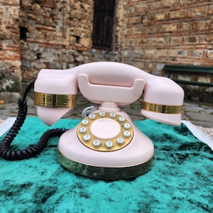 Pink digital telephone, vintage art deco design Telcer Telefonica landline phone
