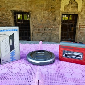 Lot of three portable audio players, cassette players and CD player