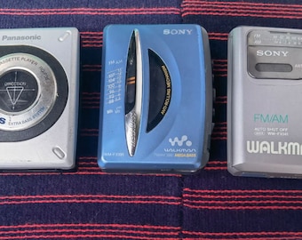 Lot of three walkman personal portable cassette tape players, Sony and Panasonic walkman