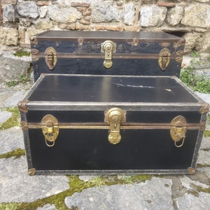 Antique wooden trunks, set of two nesting wood and leather trunks