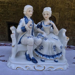 Blue and white porcelain figurine, man and a woman in Rococo clothes, XVIII century style porcelain figurine