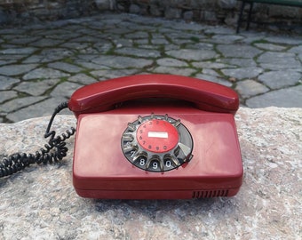 Vintage rotary Siemens phone, cherry red color vintage telephone