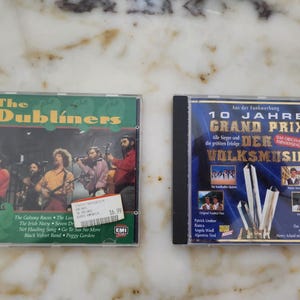 Two CDs with German folk music, vintage CDs of The Dubliners and 10 Jahre Grand Prix der Volksmusik