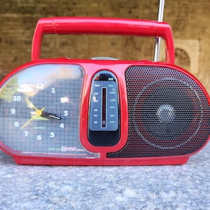 Red First Austria portable am/fm alarm clock radio, eye-catching vintage red portable radio
