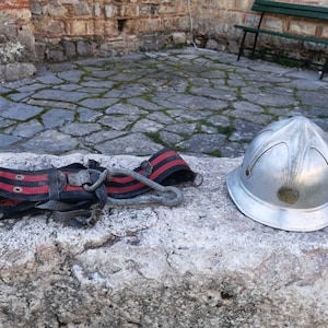 Vintage fireman helmet and a belt, metal fireman helmet and fireman belt