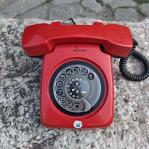 Iskra red rotary phone, vintage landline phone, 1980s dial disc telephone