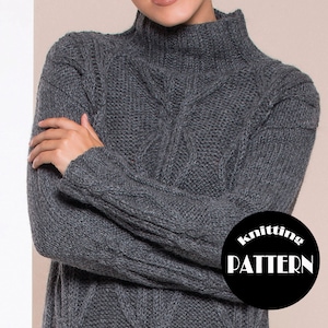 May include: A gray knitted sweater with a high neck and cable knit pattern. The sweater is folded and displayed on a light background. The text "Knitting Pattern" is visible in a black circle.