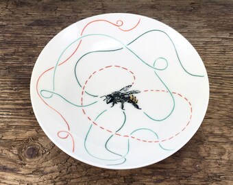 Pottery flat porcelain bowl with bee and lines