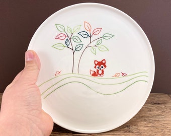 Pottery plate with porcelain fox