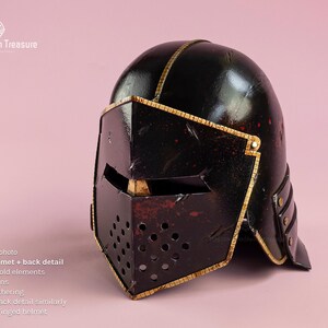 Modified version of our basic medieval foam helmet - painted in black with gold fine details.