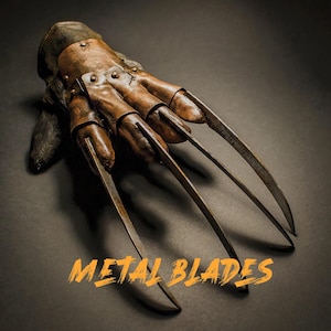 May include: A brown leather glove with four long, sharp metal blades extending from the fingertips. The glove is detailed with rivets and stitching, and the text "METAL BLADES" is displayed in orange.