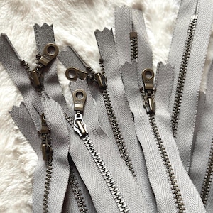 Greige YKK Zippers. 12-inch or 14-inch. Color 225. [3, 5] Pieces. Antique Brass Donut Pulls. Metal Zipper, Closed Bottom. Grey Beige Taupe