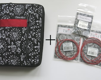May include: A black and white floral zippered case for knitting needles, with a red ribbon accent. The case is next to three packages of red Twist interchangeable knitting needles, each with a silver needle tip. The packages are labeled "Twist Red Cable 30" (30 inches) and "Small (US 5)".