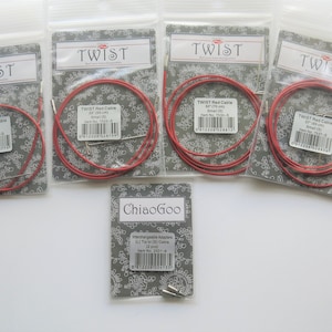 May include: Five red knitting cables in individual packaging, labeled "TWIST Red Cable" with different lengths in inches and centimeters.  One package labeled "ChiaoGoo Interchangeable Adapters 8.0 mm (US 11) Cable 6.0 inch"