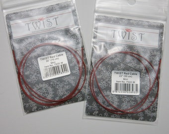 May include: Two packages of red knitting cables, one 30 inches and one 22 inches long. Both packages are labeled "TWIST Red Cable" and include the item number and size.