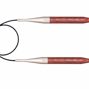 May include: A pair of circular knitting needles with a dark brown wooden handle and a silver metal tip. The needles are connected by a black cord.