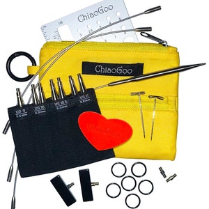 May include: A yellow zippered pouch with a set of interchangeable circular knitting needles, a gauge ruler, and a heart-shaped sticker. The needles are labeled with US sizes 9, 10, 10.5, and 11. The pouch is labeled "ChiaoGoo".