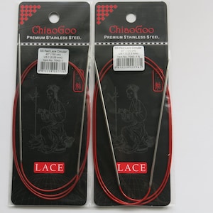May include: Two packages of red ChiaoGoo circular knitting needles. Each package contains a pair of 40-inch (100 cm) needles with a size of US 8 (5.0 mm). The packages are labeled "ChiaoGoo Premium Stainless Steel" and "5.0 Red Lace Circular 40" (100 cm) US 8 (5.0 mm) Item No. 7040-5."