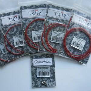 May include: Five packages of red Twist interchangeable knitting needles with different cable lengths. The packages are labeled with the brand name "Twist" and the cable length in inches and centimeters. There is also a package of ChiaoGoo interchangeable adapters.