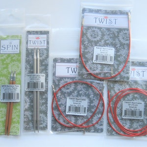 May include: A set of knitting needles and cables in various sizes and colors. The needles are made of bamboo and stainless steel. The cables are red and come in different lengths. The packaging features the brand names "Spin" and "Twist".