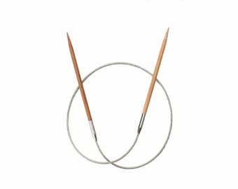 May include: A pair of circular knitting needles with a wooden tip and a silver cable.