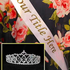 May include: White satin sash with gold glitter lettering that says "Your Title Here" and a silver tiara with rhinestones.  Personalized sash and tiara set.