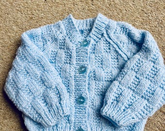 Hand knitted baby cardigan (pale blue)
