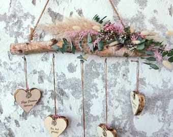 Handcrafted birch branch with motivational hearts and dried flowers