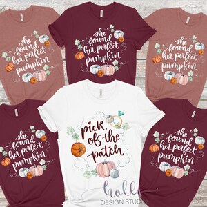 May include: Five t-shirts with a fall theme.  The shirts are maroon, white, and a light brown color.  The shirts have a watercolor design of pumpkins and leaves.  The text on the shirts says "She found her perfect pumpkin" and "Pick of the patch".