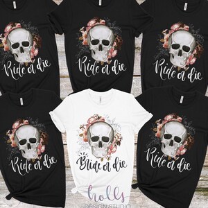 May include: Six black and white t-shirts with a floral skull graphic and the text "Ride or die" printed on the front.