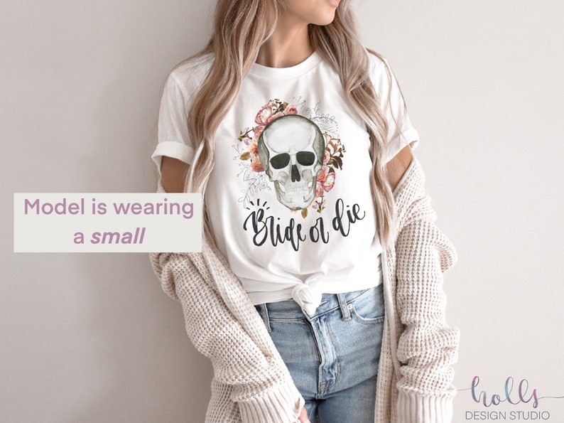 May include: White t-shirt with a floral skull graphic and the text "Ride or Die".