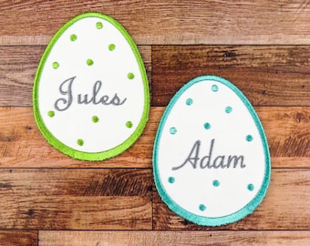 First name embroidered on egg-shaped patch, color of your choice, font of your choice, iron-on option or not