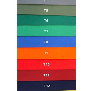 K&ouml;nnte beinhalten: Eine Farbkarte mit 16 verschiedenen Stoffmustern. Die Muster sind von T1 bis T16 beschriftet. Die Farben umfassen Wei&szlig;, Schwarz, Braun, Grau, Gr&uuml;n, Blau, Orange, Rot, Weinrot, Gelb, Beige und Hellblau.