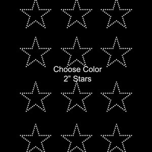 May include: Nine white 2 inch star-shaped rhinestones on a black background. Choose Color 2" Stars.