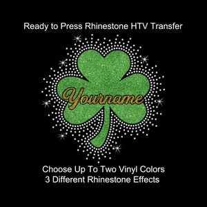 May include: A green glitter shamrock design with the word "Yourname" in gold script, surrounded by a white rhinestone border. The text "Ready to Press Rhinestone HTV Transfer" and other details are also included on a black background.