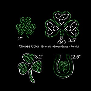 May include: Four different sizes of green shamrock designs made of rhinestones. The shamrocks are 2 inches, 3.5 inches, 3.2 inches, and 2.5 inches. The text "Choose Color Emerald - Green Grass - Peridot" is below the shamrocks.