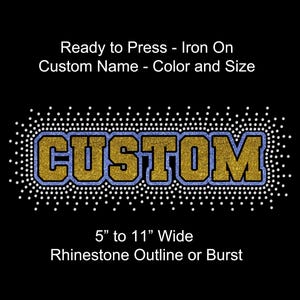 May include: A custom iron-on design with the word "CUSTOM" in gold glitter letters outlined in blue, surrounded by a rhinestone border. The design is 5 to 11 inches wide and can be customized with a name, color, and size. The text "Ready to Press - Iron On" is at the top.