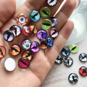 Cabujones de ojo de dragón mezclados al azar, bolsa sorpresa de 10 mm a 25 mm, cúpula de vidrio con imagen de ojos de animal para bricolaje, para ojos de muñeca, bolsa misteriosa, ROMB04